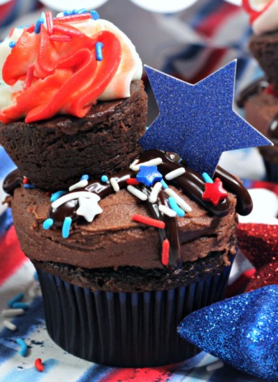 close up of chocolate cupcake with red white & blue sprinkles