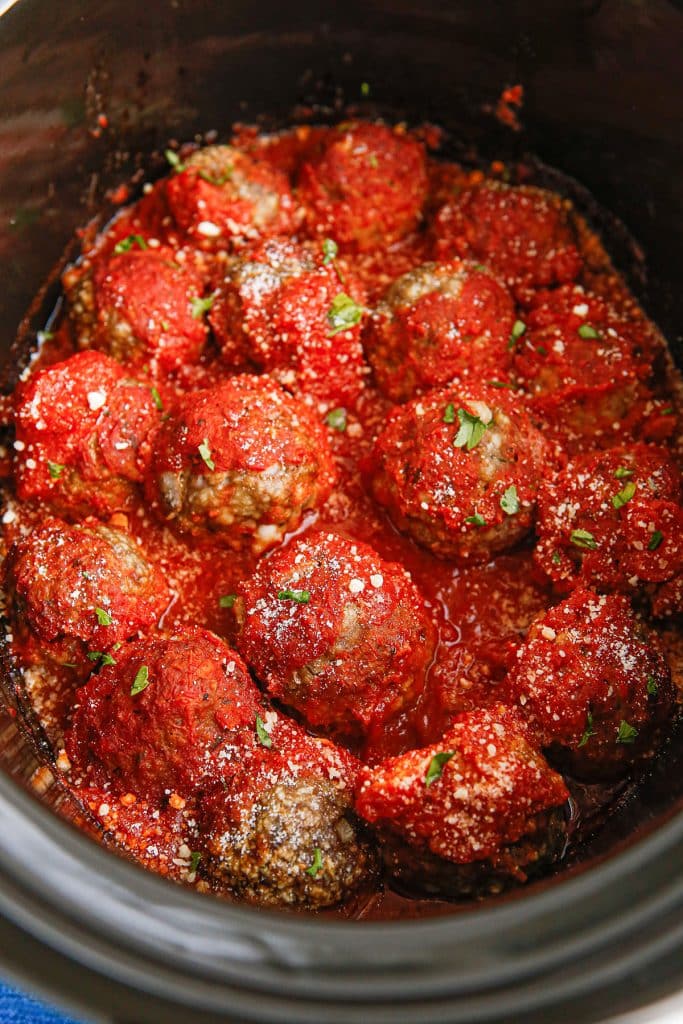 overhead shot of saucy meatballs in a slow cooker.