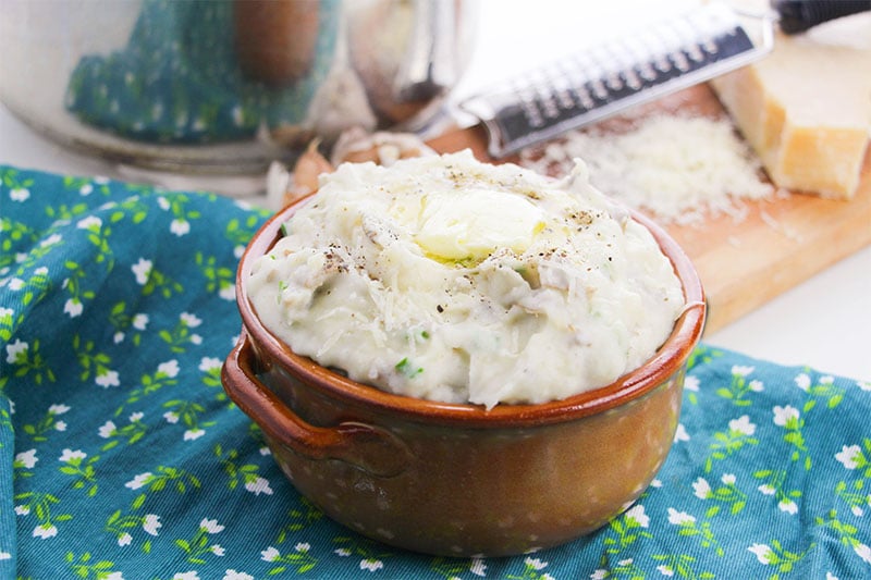 garlic mashed potatoes in a bowl with butter