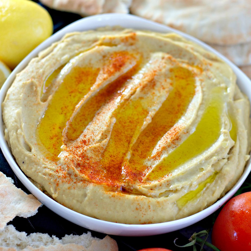 zoomed in photo of hummus in a serving dish