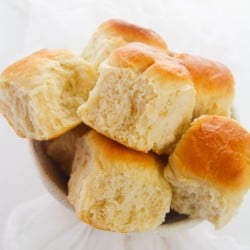 several dinner rolls in a bowl from above