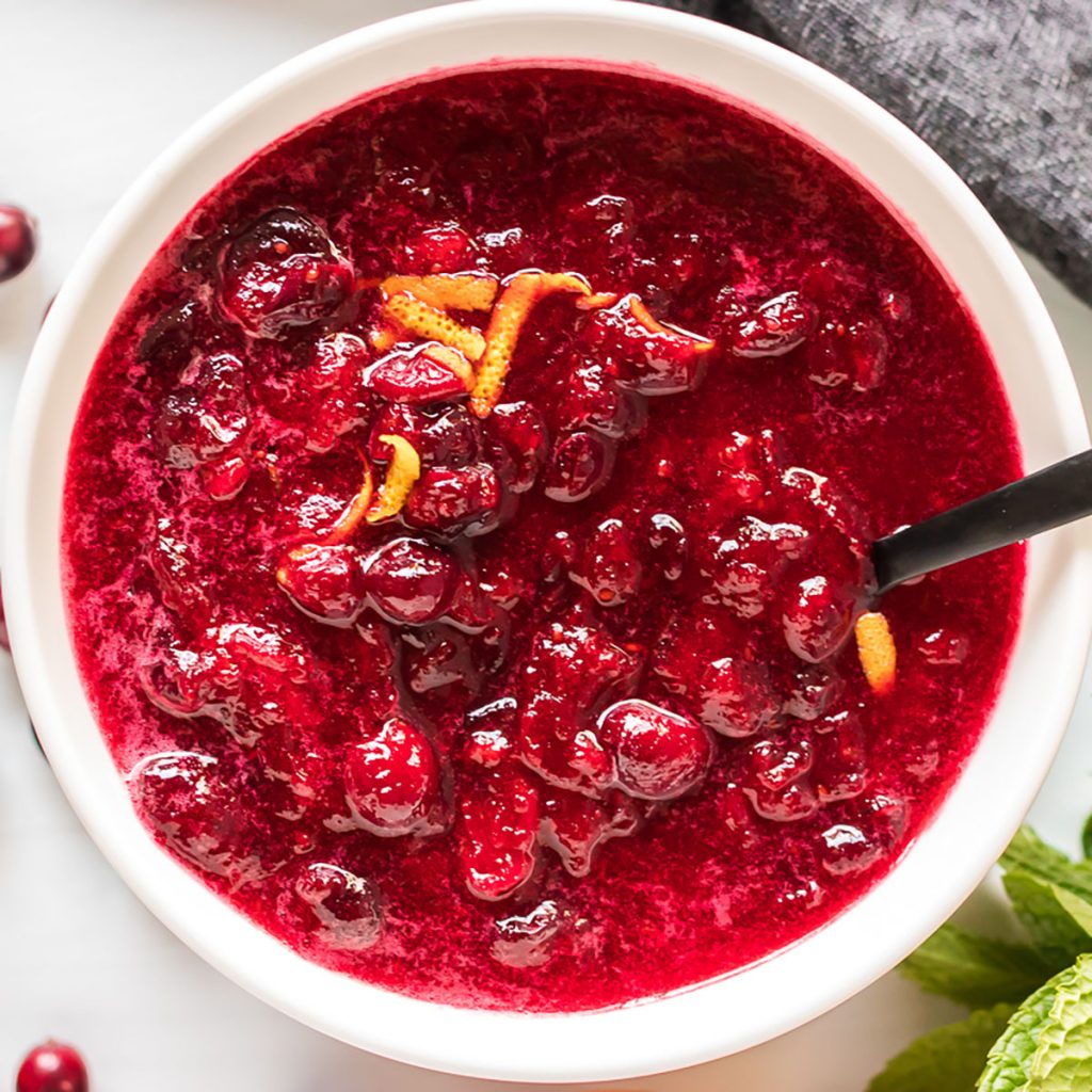 overhead shot of cranberry sauce in white bowl