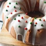 bundt cake drizzled with icing & topped with red & green sprinkles