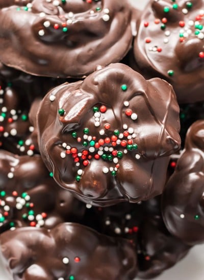 stack of chocolate peanut clusters with christmas sprinkles