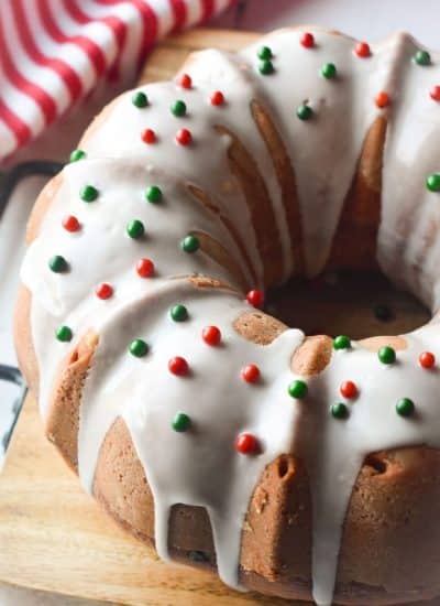 bundt cake topped with icing and red & green sprinkles