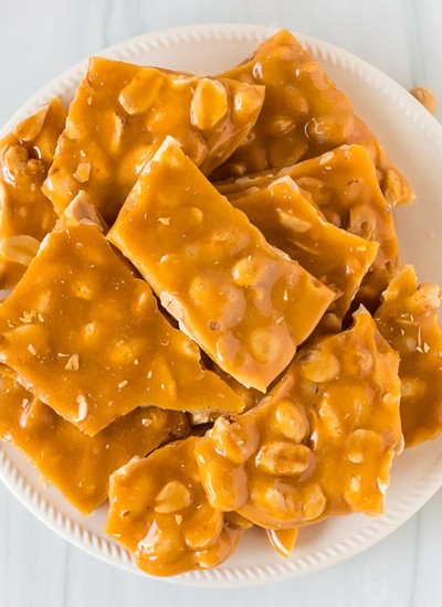 stack of peanut brittle on a white plate