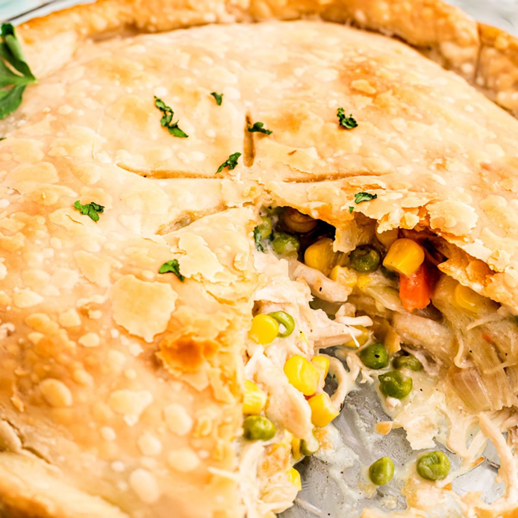 closeup of chicken pot pie with a slice missing