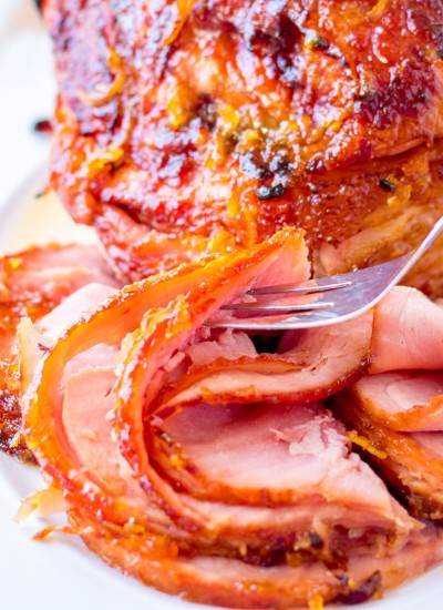 fork picking up a slice of spiral sliced ham