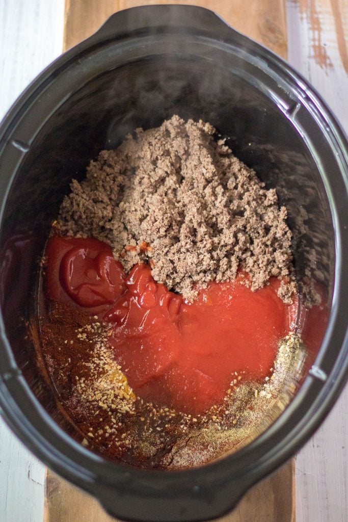 overhead shot of crockpot filled with beef & ketchup