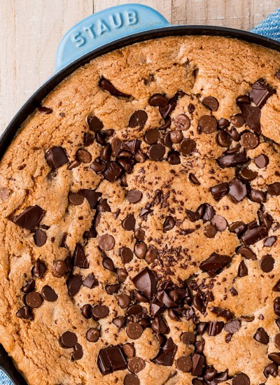 overhead shot of a chocolate chip skillet cookie on a blue napkin