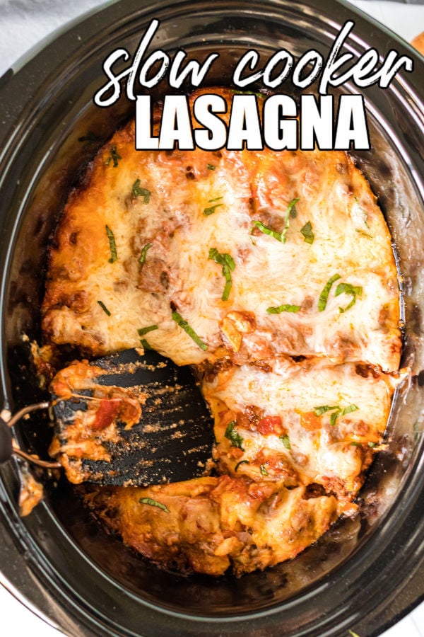 scoop being taken out of a slow cooker of lasagna