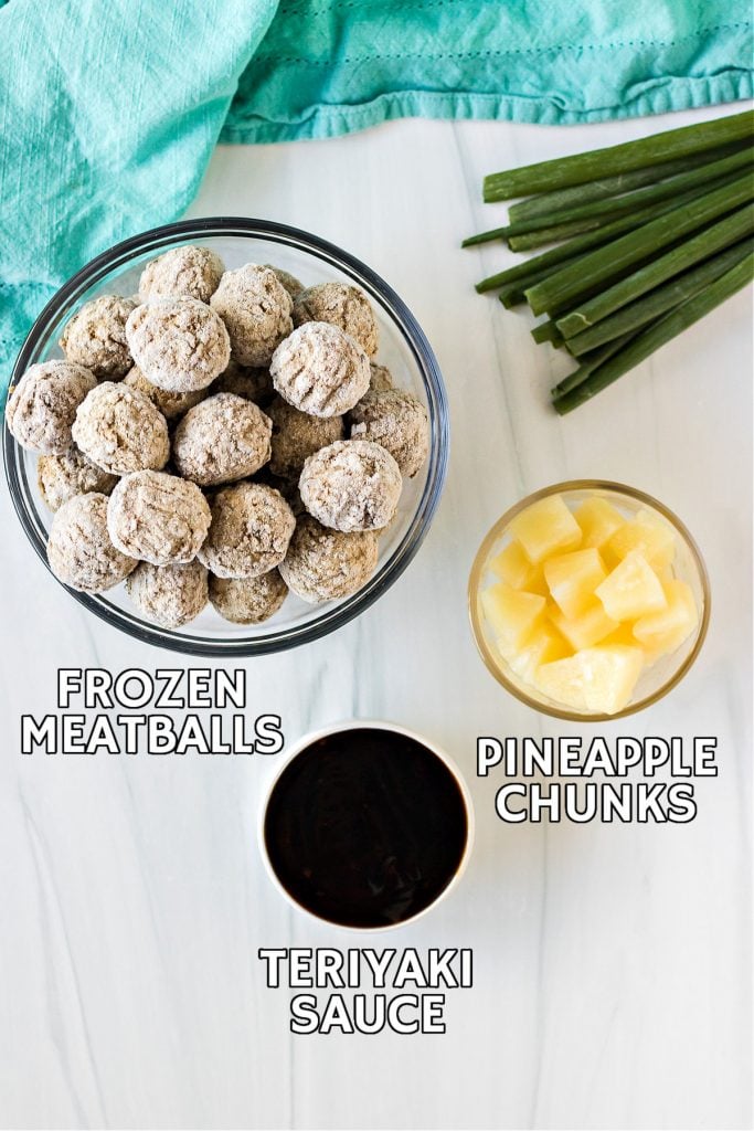 overhead shot of frozen meatballs, pineapple, and teriyaki sauce laid out to make slow cooker teriyaki meatballs