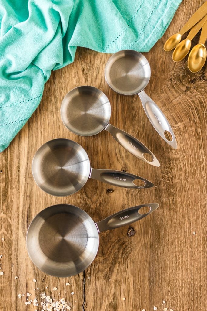 overhead shot of empty measuring cups on a wood table