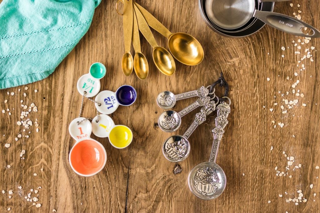 overhead shot of 3 sets of measuring spoons on a table