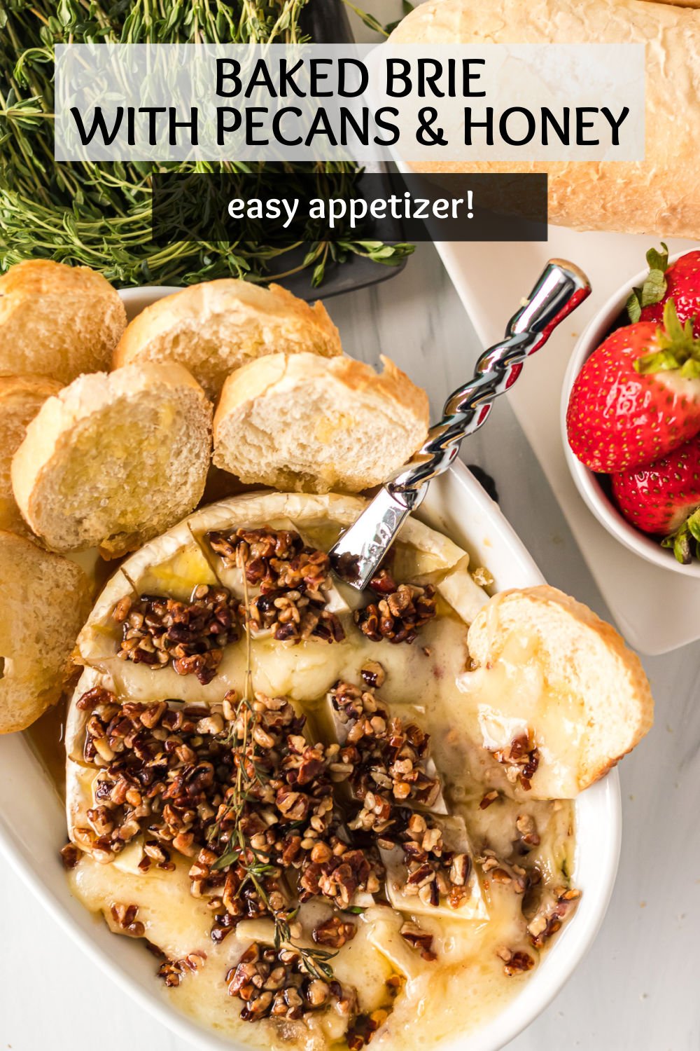 This baked brie recipe features a rich, creamy, buttery brie round and is topped with naturally sweet honey, fresh, fragrant thyme, red pepper flakes, and finished with pecans for the perfect honey nut brie centerpiece! | persnicketyplates.com