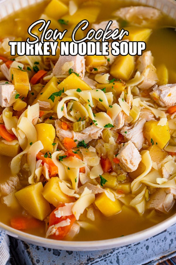 closeup of turkey noodle soup with text reading "slow cooker turkey noodle soup"