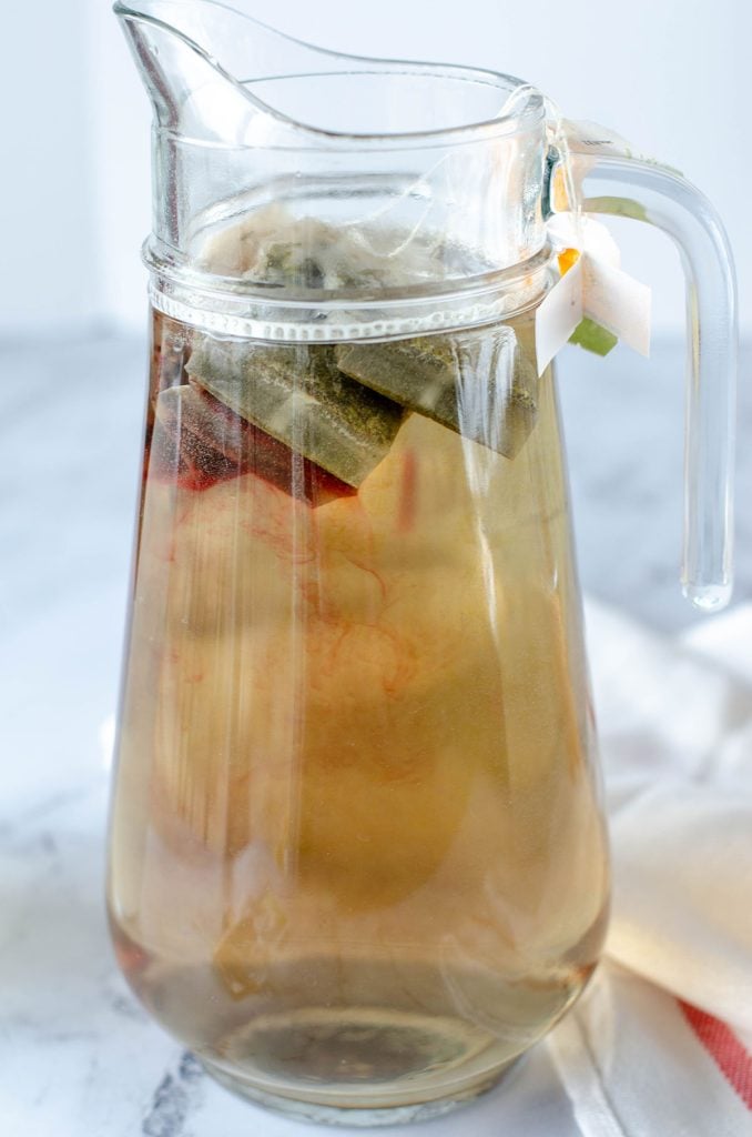 pitcher full of tea bags steeping