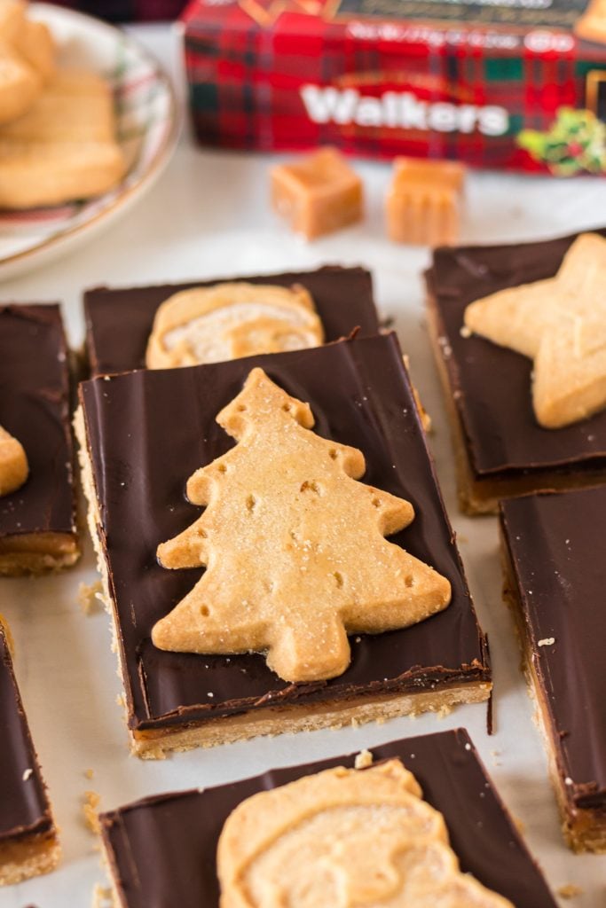 closeup of millionaire bar topped with christmas tree shortbread cookie