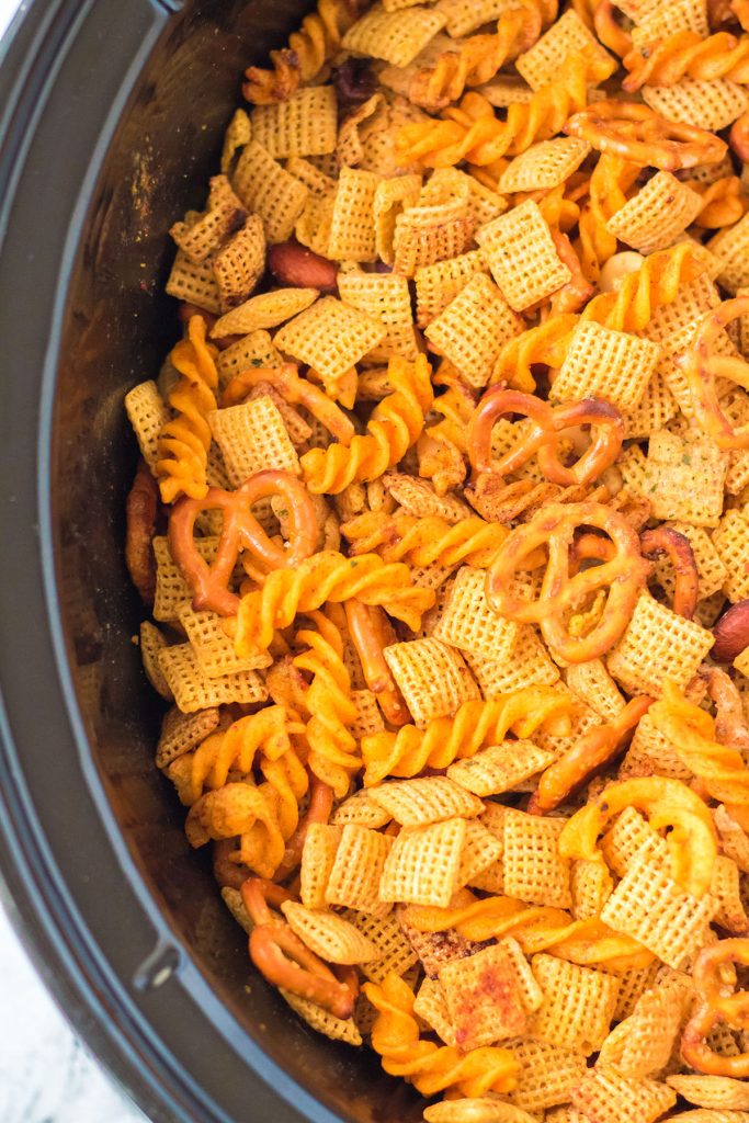 closeup of cajun chex mix in a slow cooker
