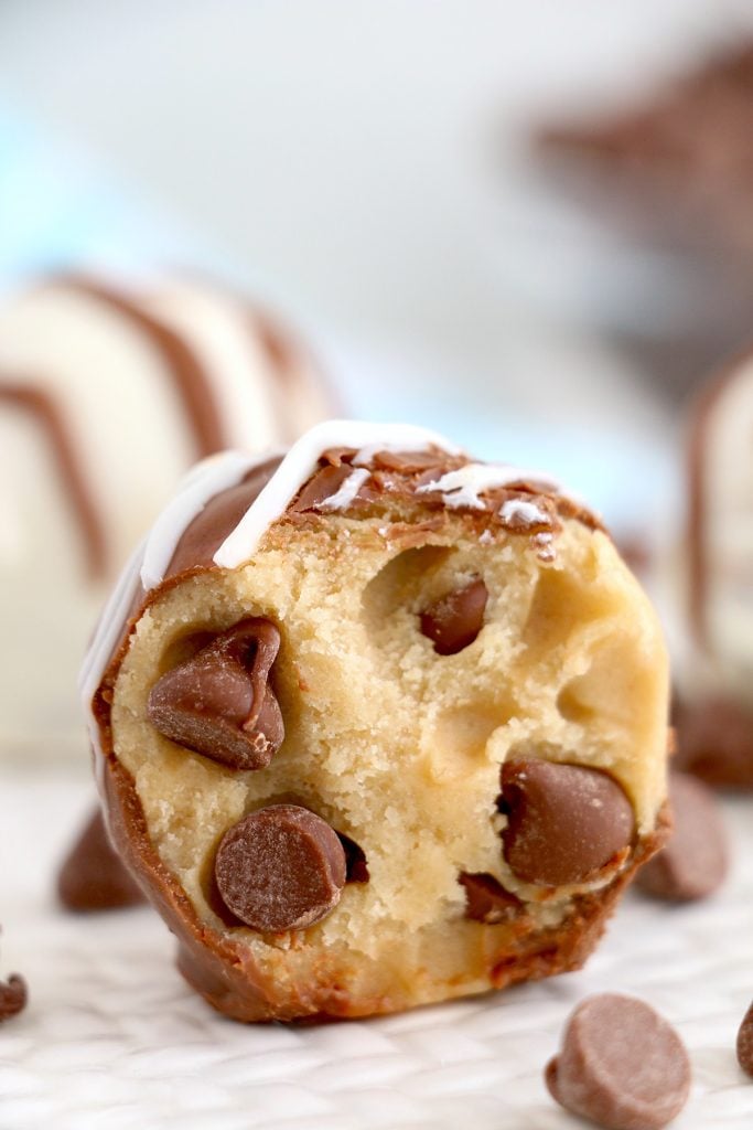 closeup of edible cookie dough ball dipped in chocolate