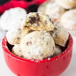 red bowl filled with chocolate chip snowball cookies
