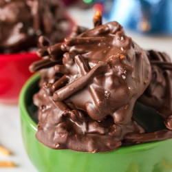 close up of chocolate haystacks in a green bowl