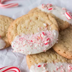 sugar cookie dipped in white chocolate & sprinkled with crushed candy canes