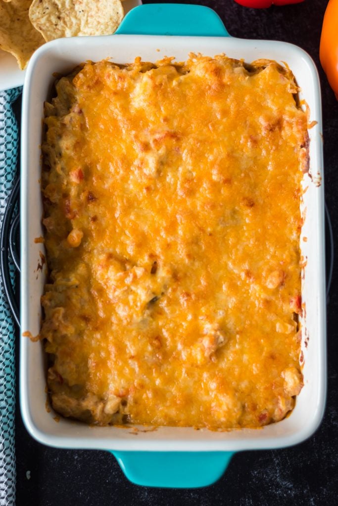 cheesy baked casserole in a teal baking dish