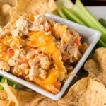 chicken fajita dip surrounded by tortilla chips and celery sticks