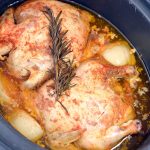 overhead shot of two cornish game hens in a crockpot.