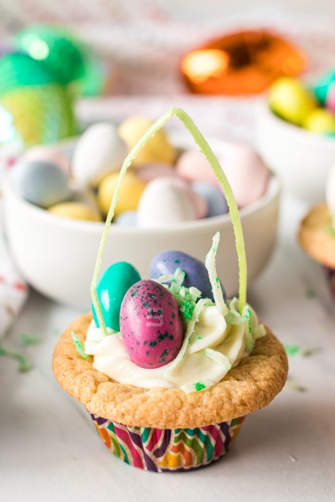easter basket cookie cup filled with egg candies.