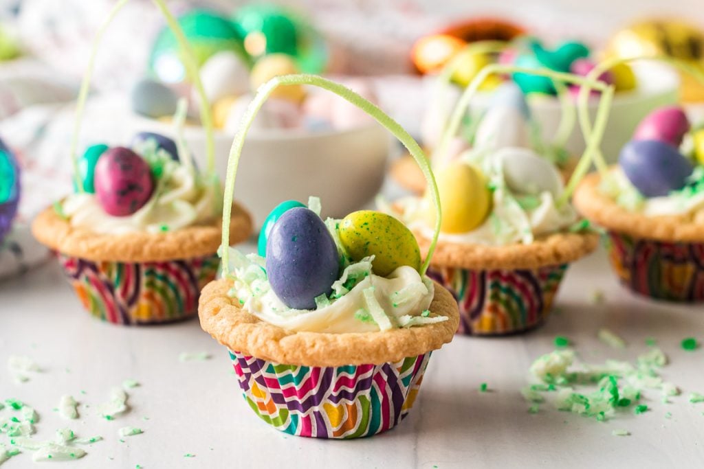 several cookie cups that look like easter baskets.
