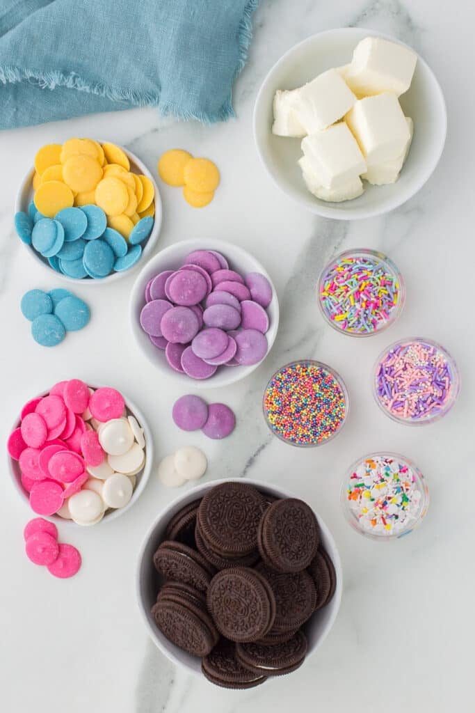 overhead shot of oreos, candy melts, and sprinkles to make easter truffles.