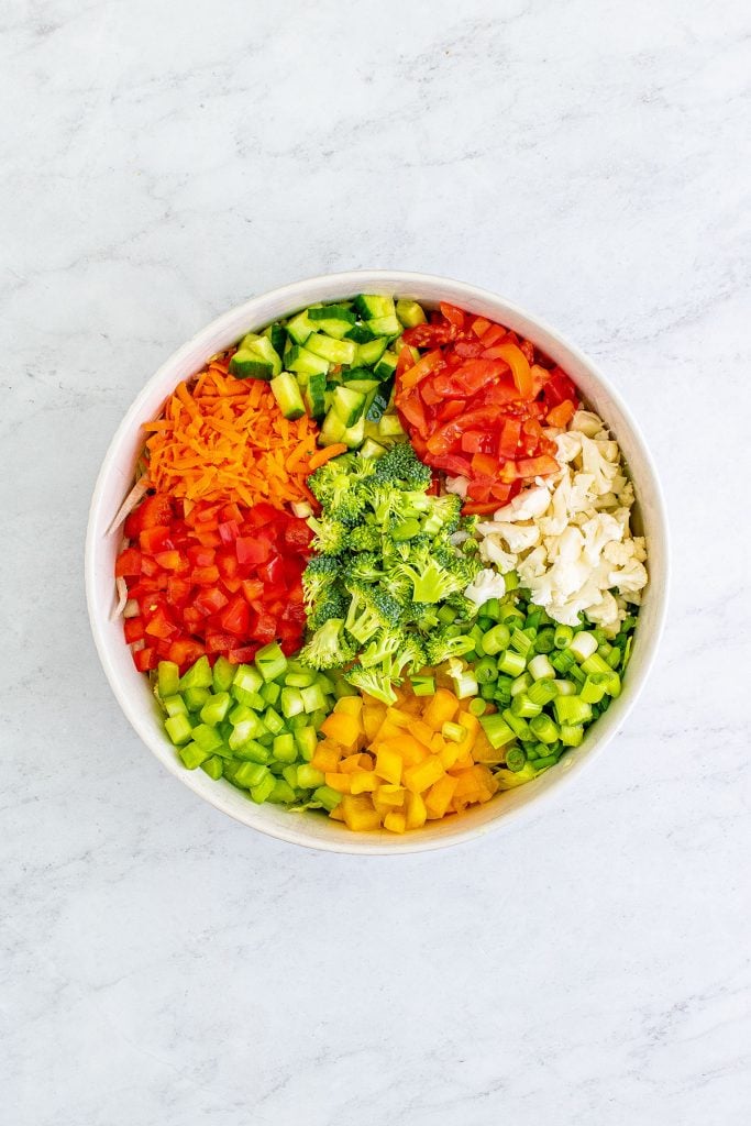 overhead shot of chopped vegetables in a large bowl.