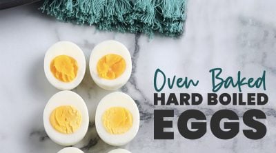 overhead shot of sliced eggs with text reading "oven baked hard boiled eggs"