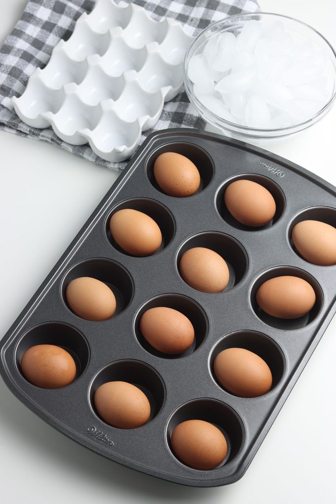 brown eggs in a muffin tin.