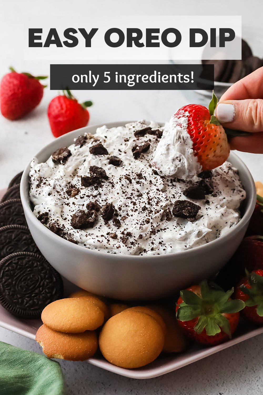 You only need five simple ingredients to make this easy Oreo dip! Loaded with cream cheese, whipped cream, and crushed Oreo cookies, this sweet dip is perfect for dipping strawberries, nilla wafers, and more. | www.persnicketyplates.com