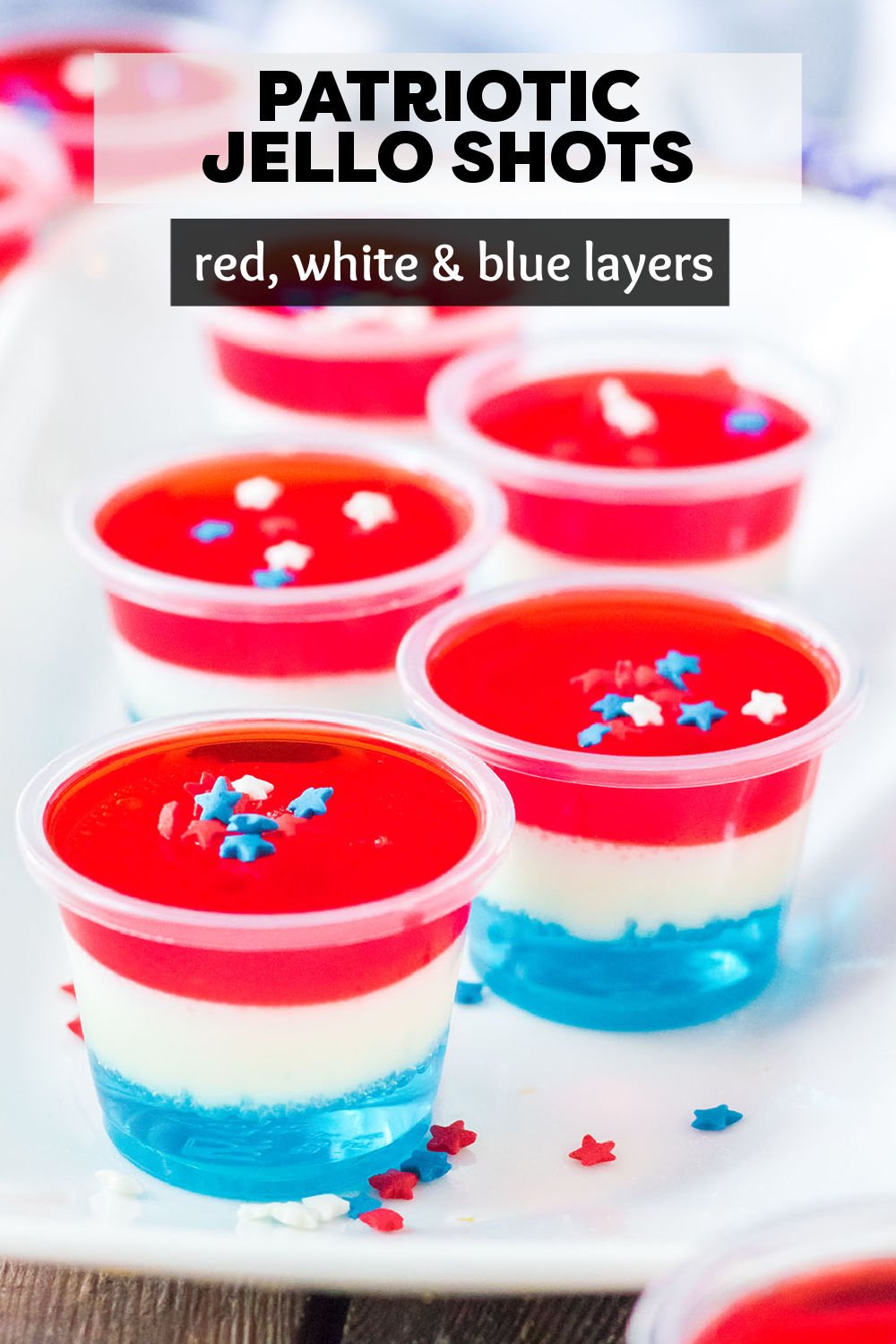 These layered Red White & Blue Jello Shots are perfect for a summer party. Make a batch of American Flag Jello Shots for Fourth of July, Memorial Day, or whenever you're feeling especially patriotic. | www.persnicketyplates.com
