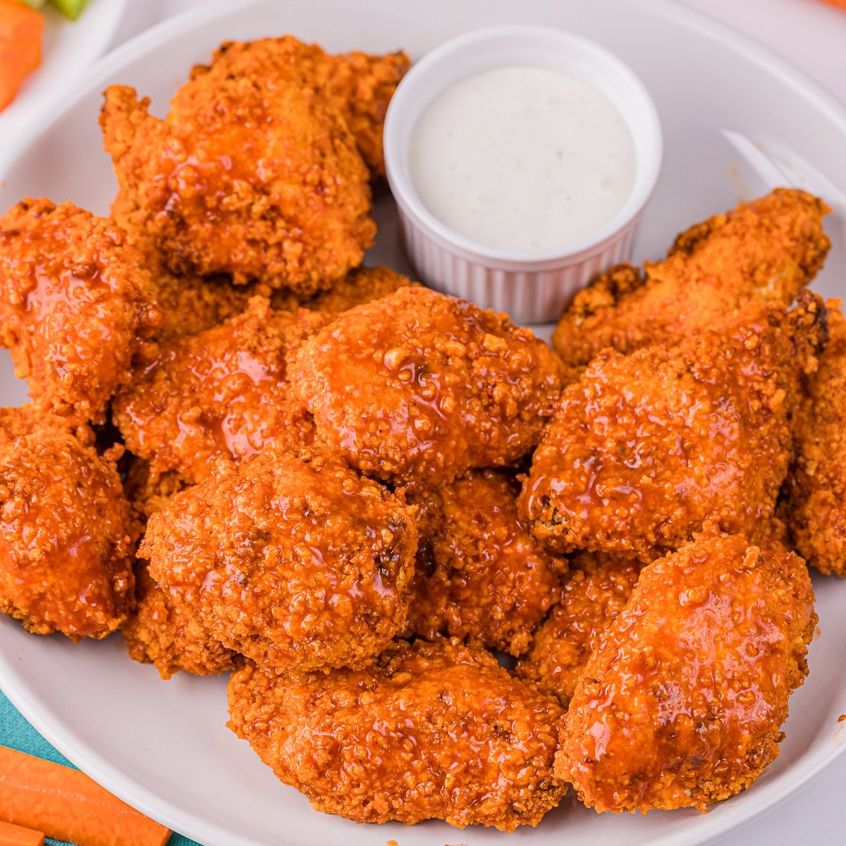 plate of boneless wings with a cup of ranch dressing.