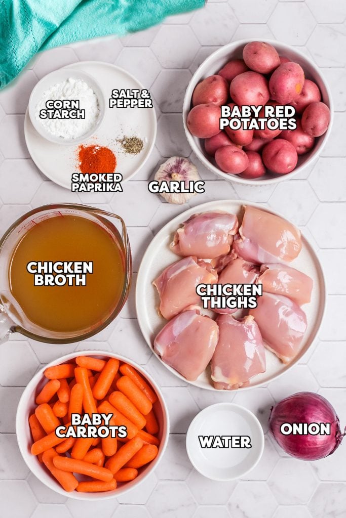overhead shot of labeled ingredients laid out to make chicken thighs in the crock pot.