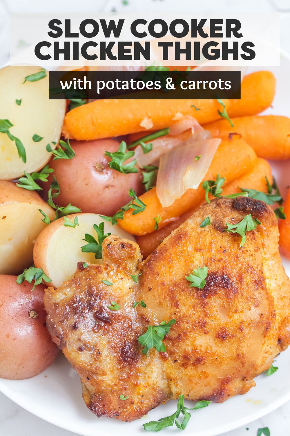 Slow Cooker Chicken Thighs with Potatoes & Carrots is an easy recipe that makes your entire dinner right in the crockpot! Juicy chicken thighs, tender potatoes and carrots, and a flavorful chicken gravy to pour over the top make this a meal the whole family will love. | www.persnicketyplates.com