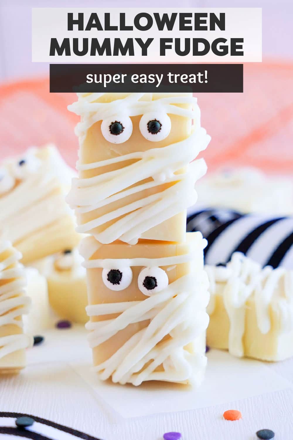 White chocolate Halloween Fudge is a fun and easy treat for the Halloween dessert table. Dressed up like mummies, this easy fudge recipe only requires a few ingredients. | www.persnicketyplates.com
