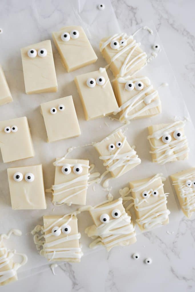 overhead shot of white chocolate fudge with candy eyeballs & drizzled chocolate.