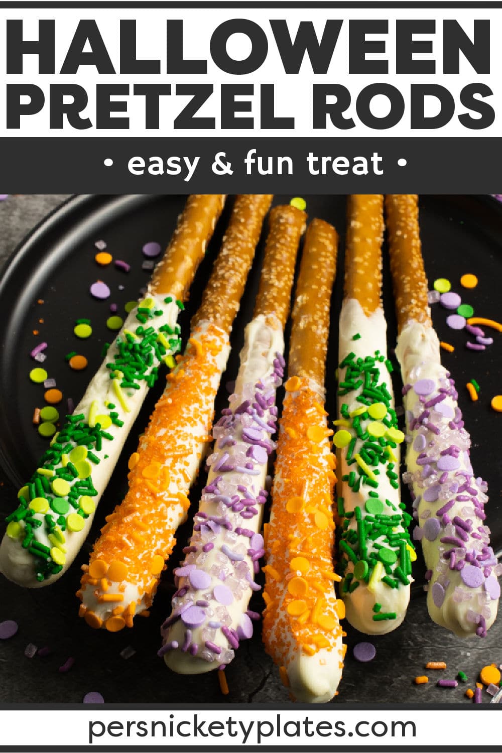 Super simple Halloween Pretzel Rods are always a hit. Salty pretzels dipped into sweet white chocolate and then topped with festive sprinkles. Perfect for a halloween party! | www.persnicketyplates.com