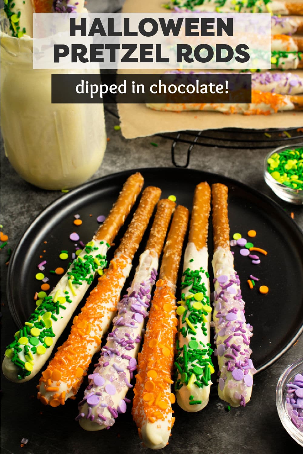 Super simple Halloween Pretzel Rods are always a hit. Salty pretzels dipped into sweet white chocolate and then topped with festive sprinkles. Perfect for a halloween party! | www.persnicketyplates.com