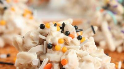 closeup of crockpot candy with halloween sprinkles.