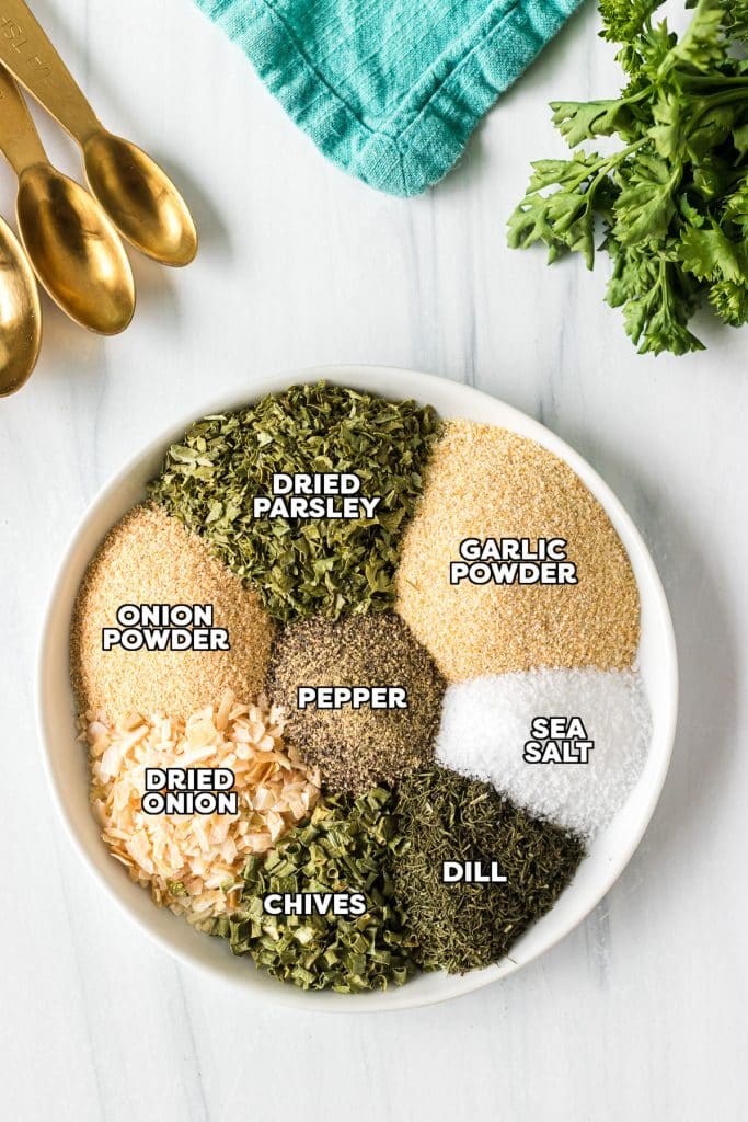 overhead shot of labeled ingredients on a plate to make ranch seasoning.
