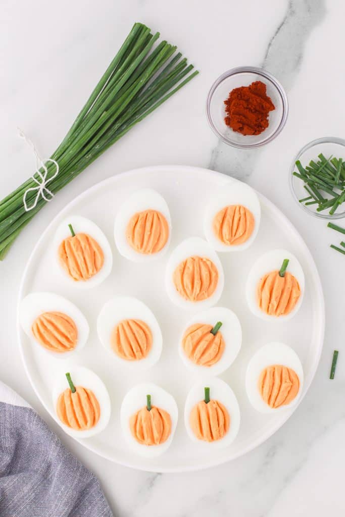 deviled eggs piped to look like pumpkins.