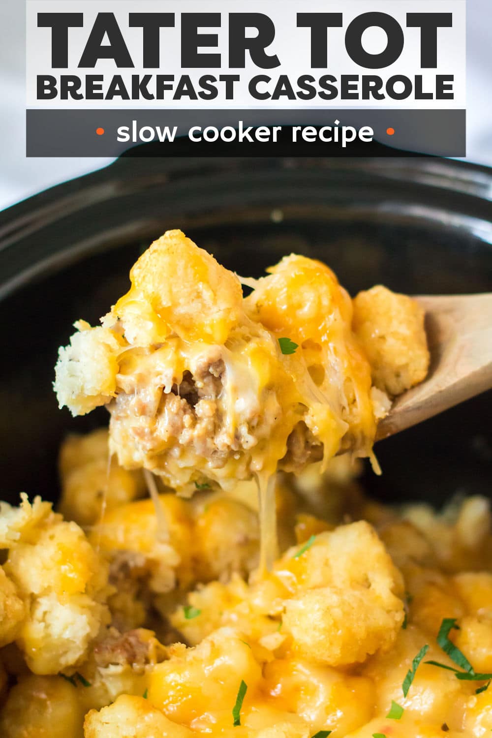 Slow Cooker Tater Tot Breakfast Casserole is a delicious, hearty breakfast bake that comes together right in the slow cooker!  Tater tots, sausage, eggs, and cheese make this savory casserole a favorite for kids and adults alike! | www.persnicketyplates.com