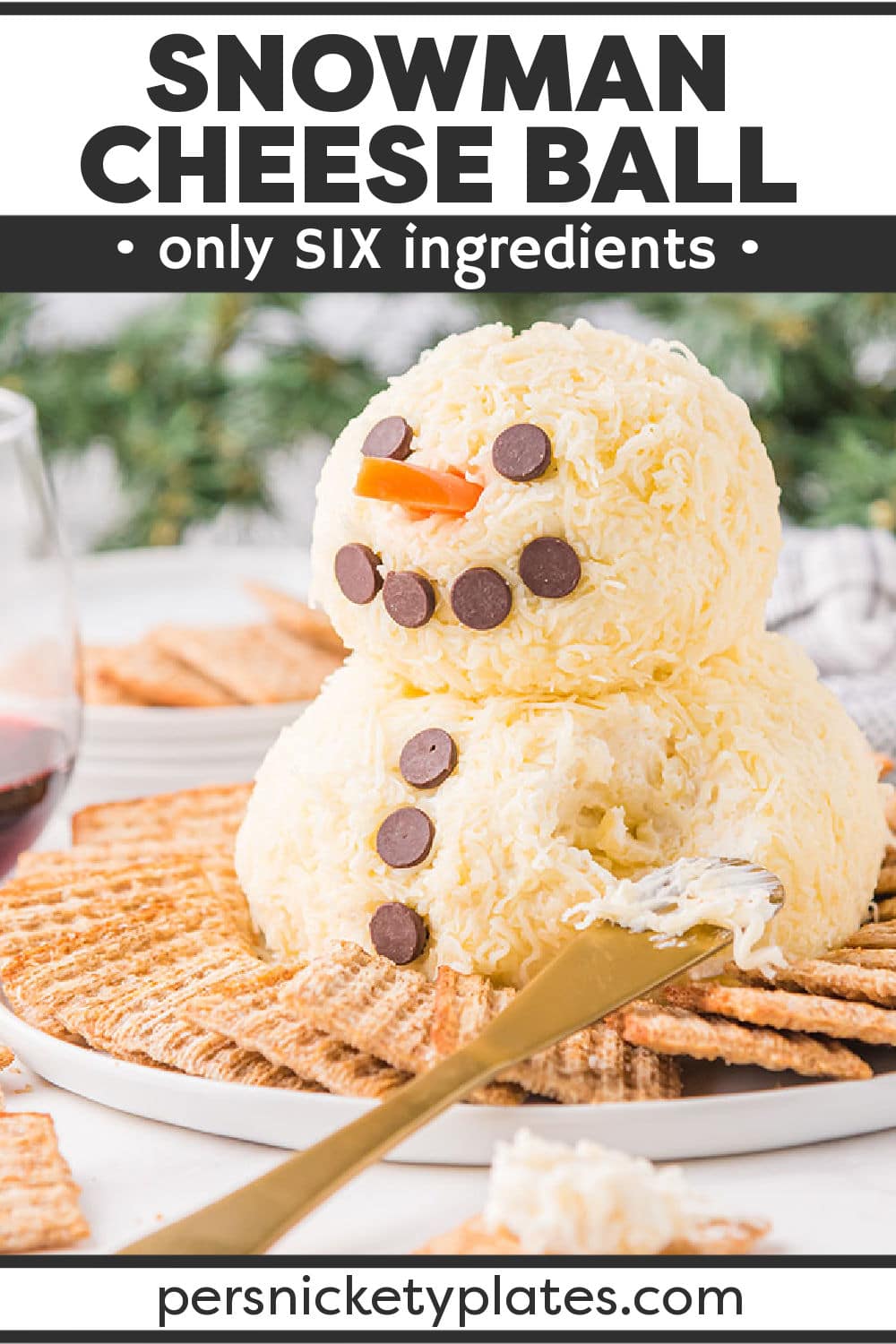 This easy, festive, and super adorable Snowman Cheese Ball is the perfect appetizer made with two different kinds of cheese for the body and fun add-ons for the face! It’s a simple, cost-effective way to delight your friends and family during the holiday season! | www.persnicketyplates.com